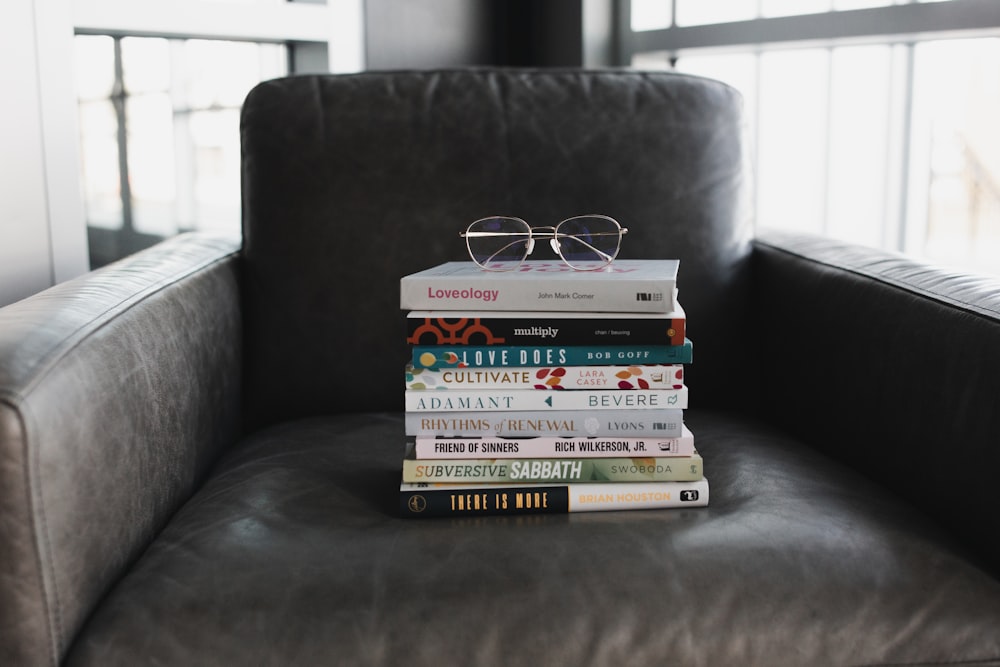 assorted books on black couch