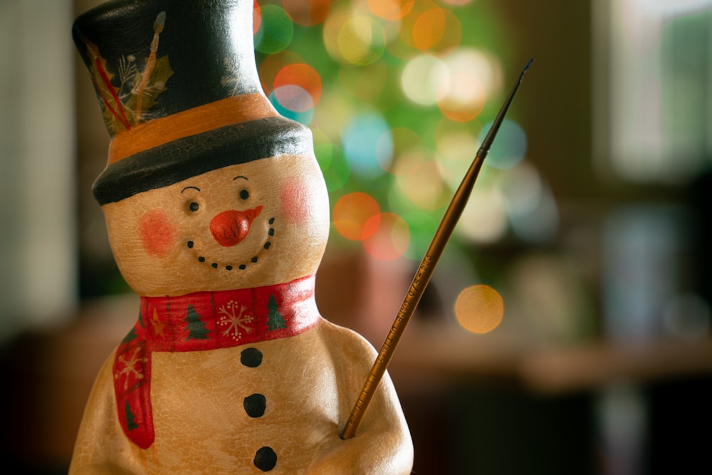 brown and red snowman figurine