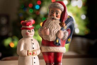 man in red and blue suit figurine kris kringle google meet background