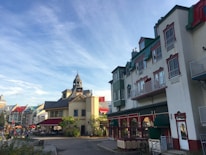 A charming street view of the local village with colorful buildings and visitors.