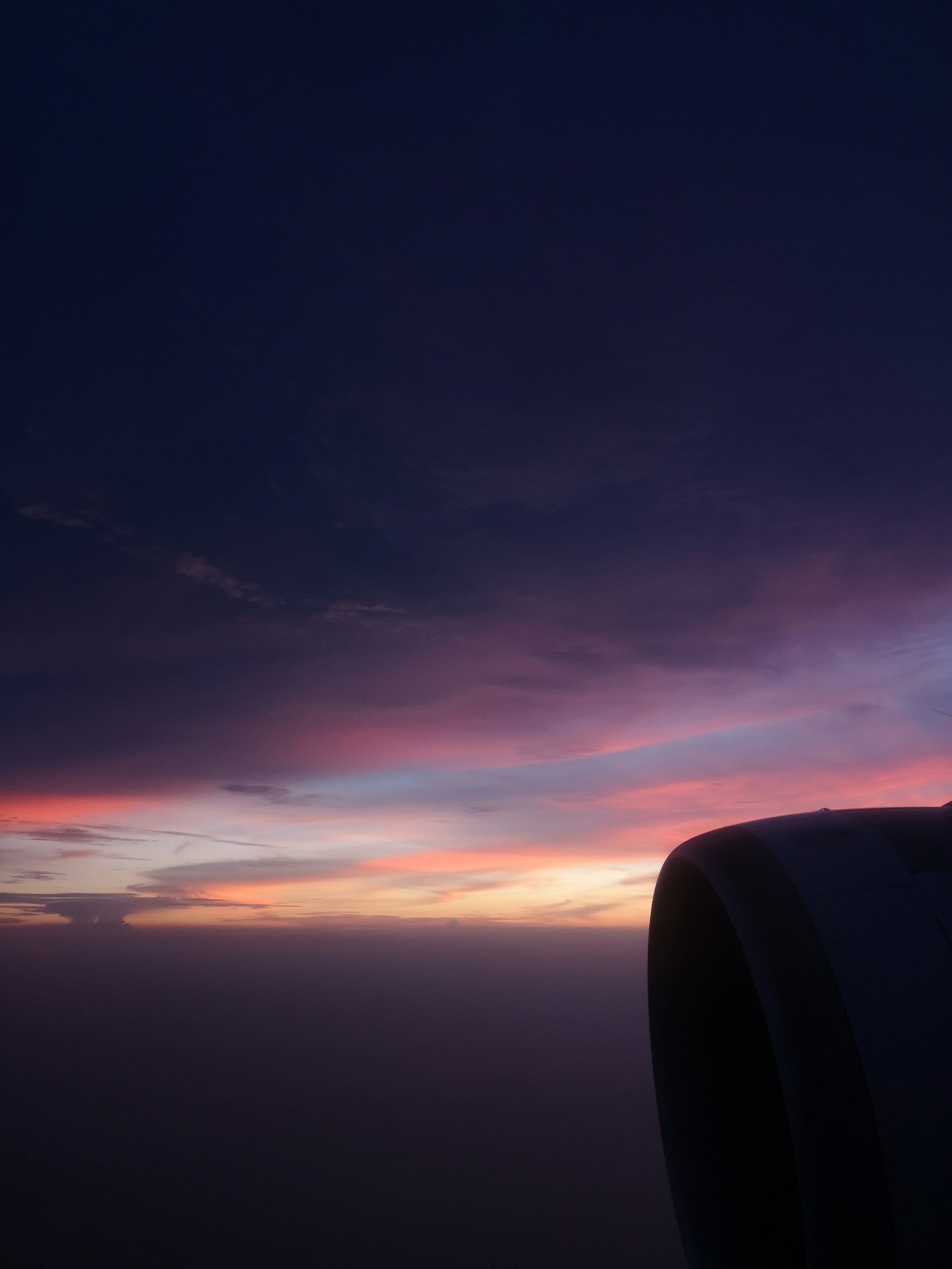 A scenic sunset view from an airplane window, capturing the excitement of budget-friendly adventures.