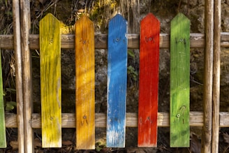 blue and yellow wooden fence