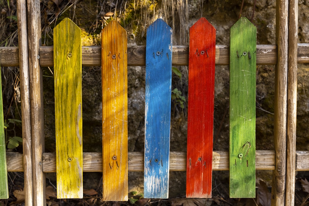 blue and yellow wooden fence