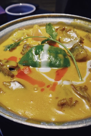 soup with vegetables on stainless steel bowl