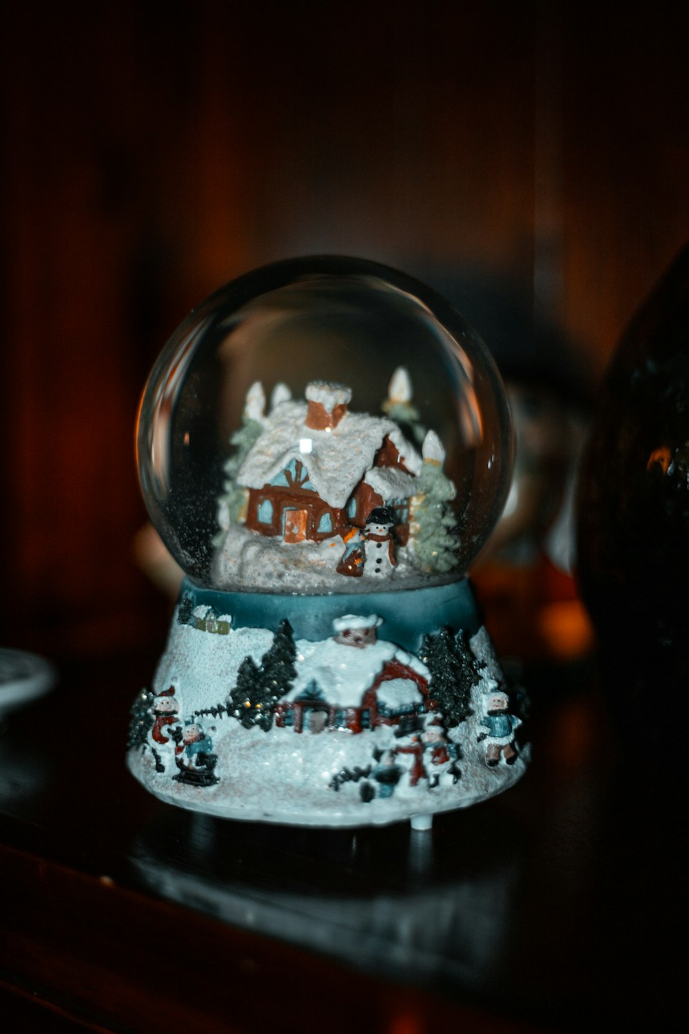 white and black snowman snow globe