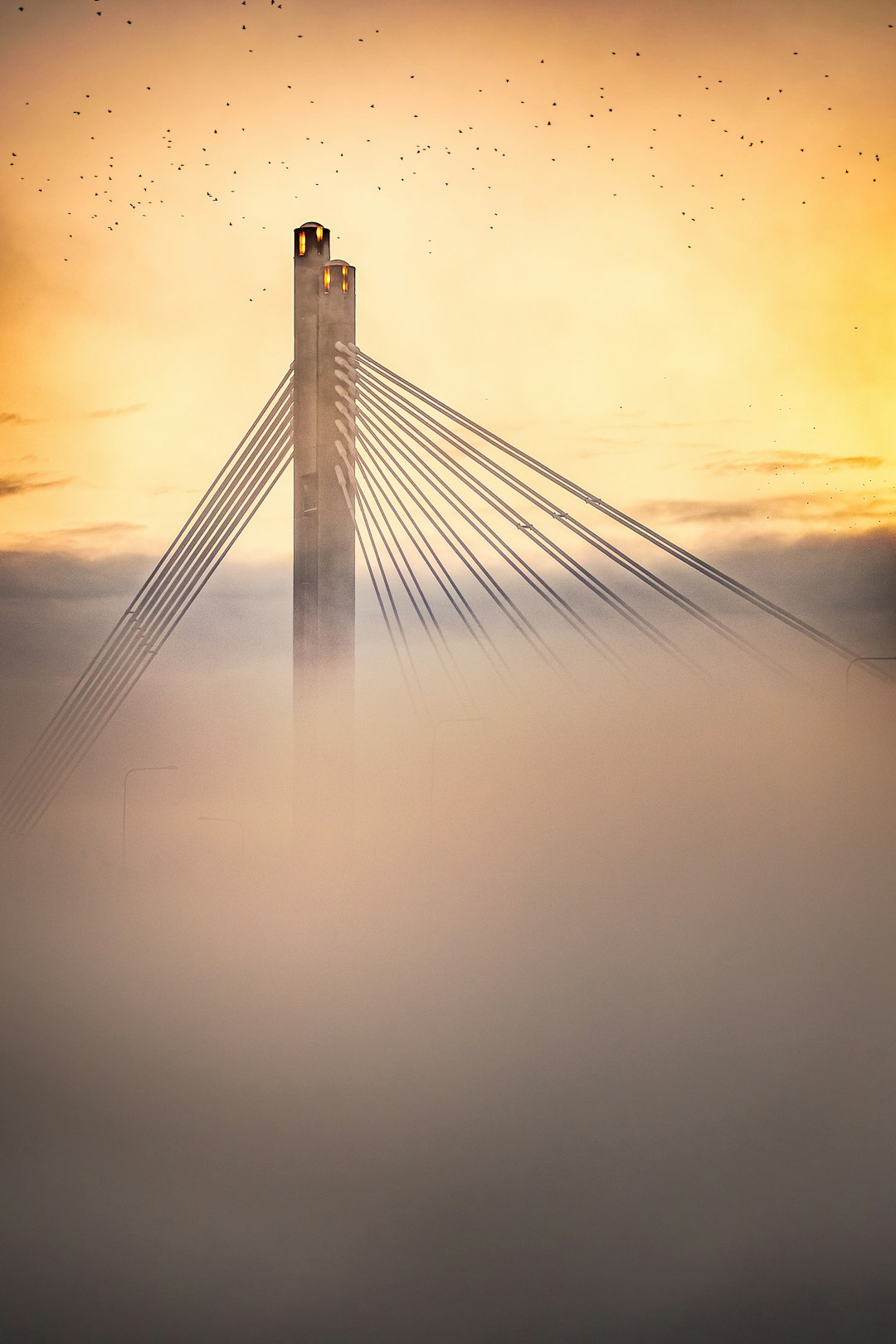 gray bridge under white clouds