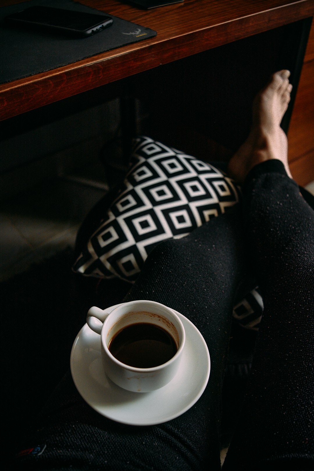 person holding white and black textile