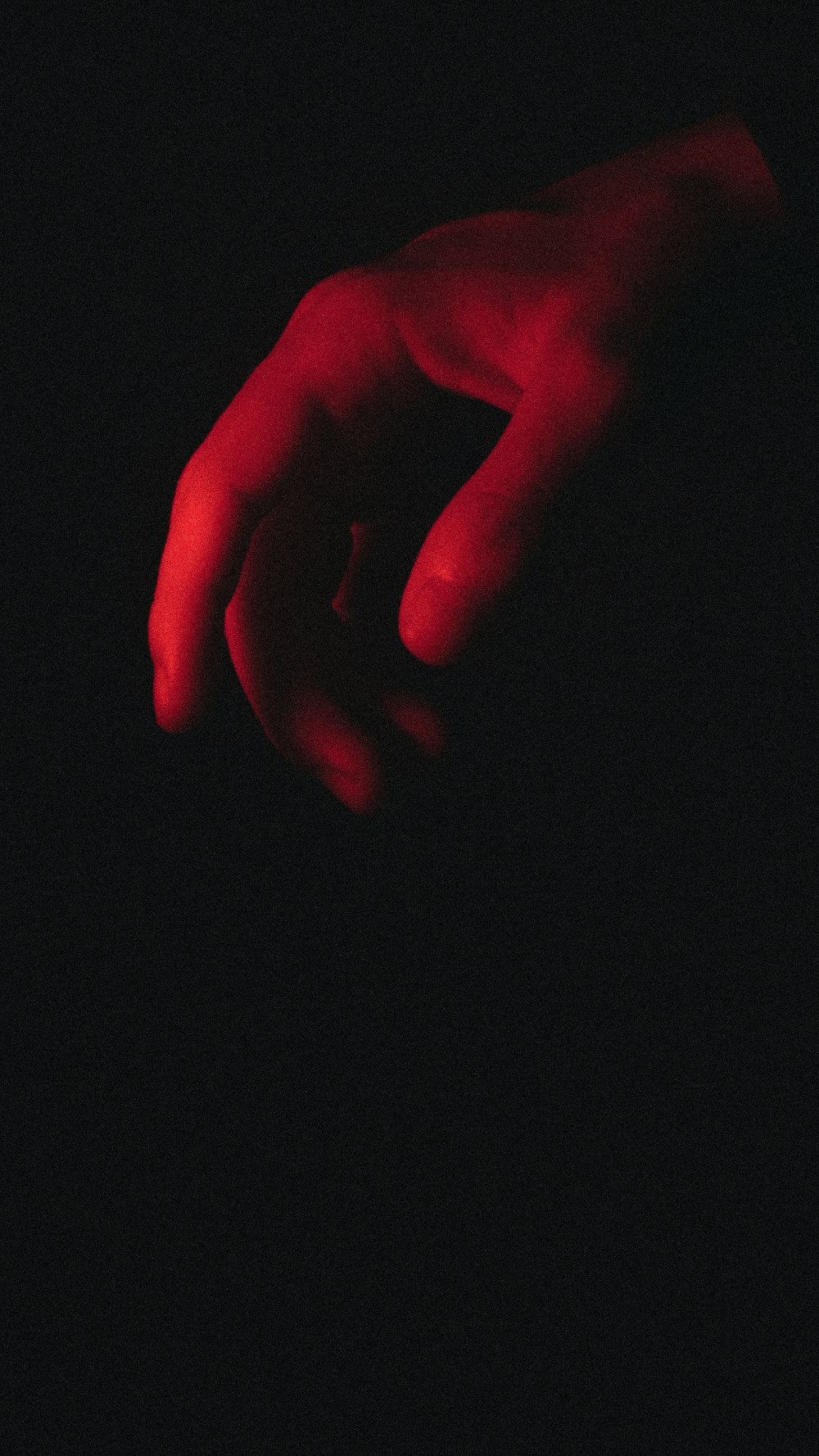 persons hand on black textile