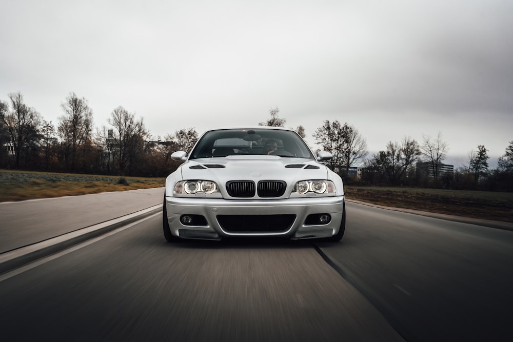 white bmw m 3 on road during daytime