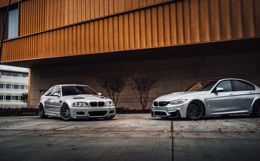 white bmw m 3 coupe parked beside orange wall