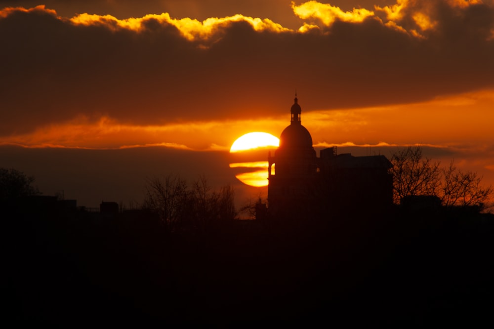 silhouette of building during sunset