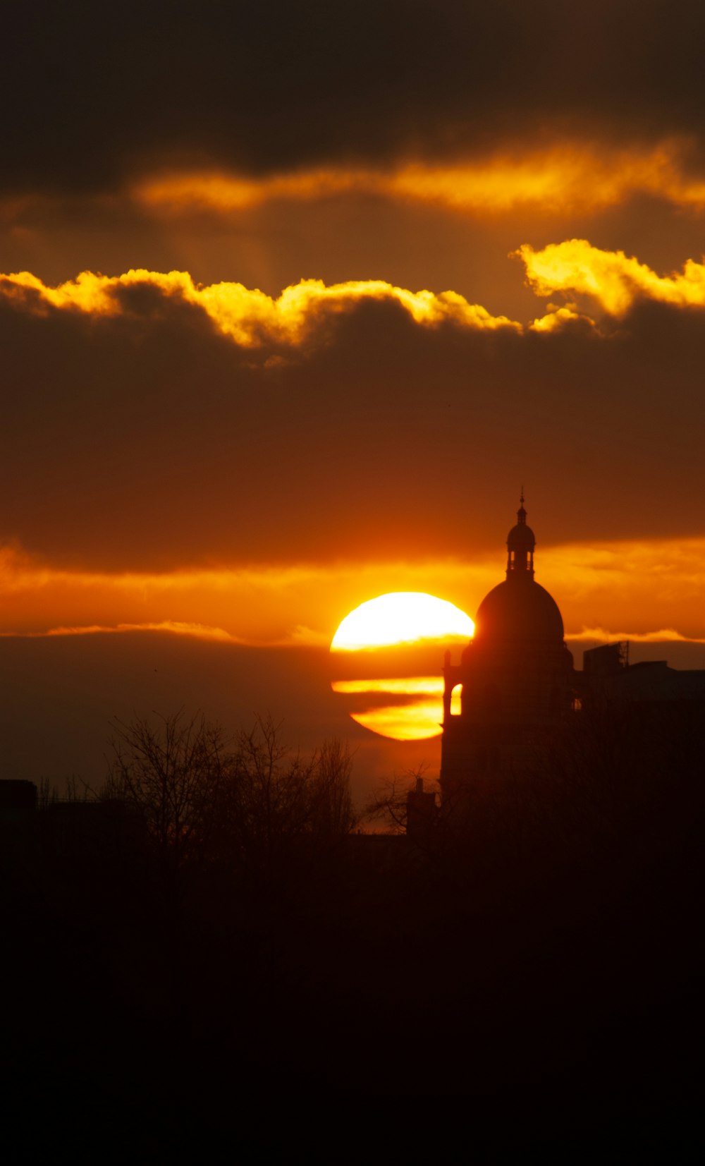 silhouette of building during sunset