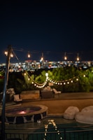 Evening scene of Patio Splendid with ambient lights highlighting the open layout and urban surroundings.
