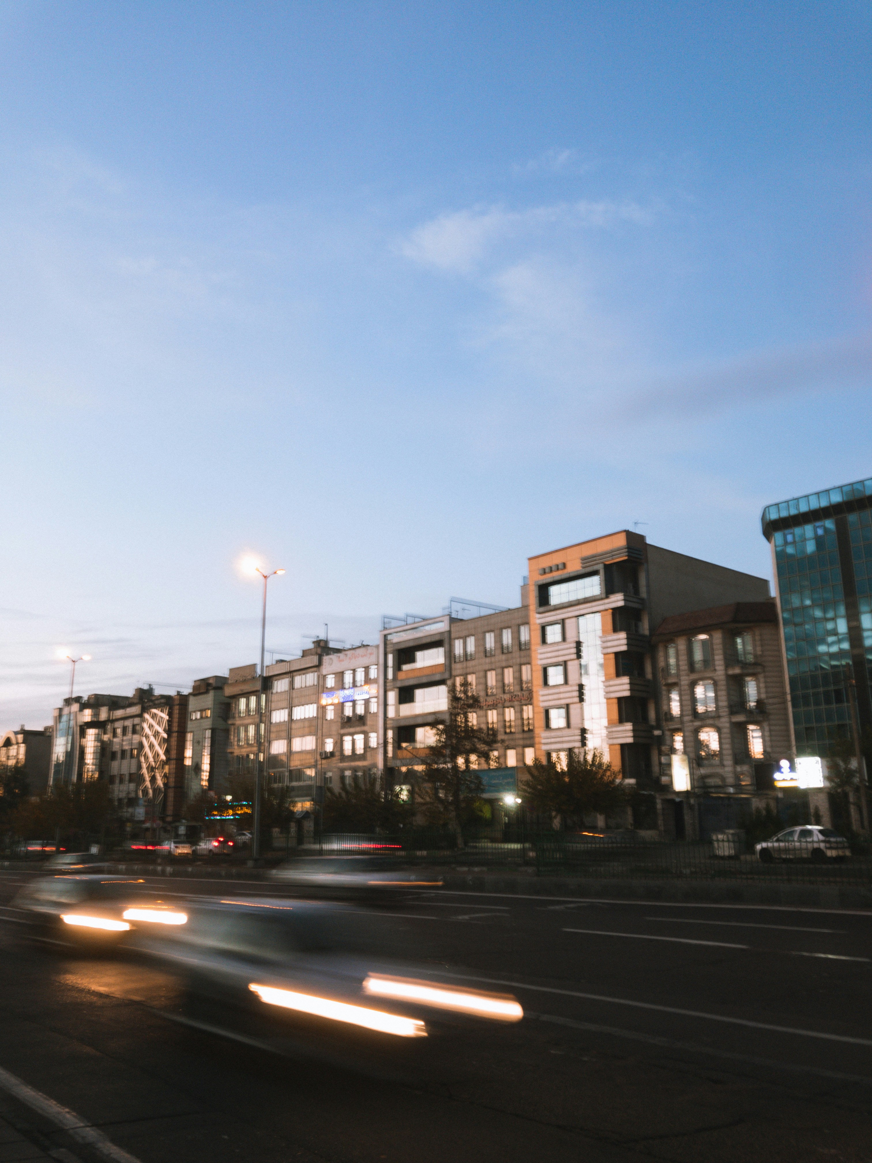 cars on road near buildings during daytime