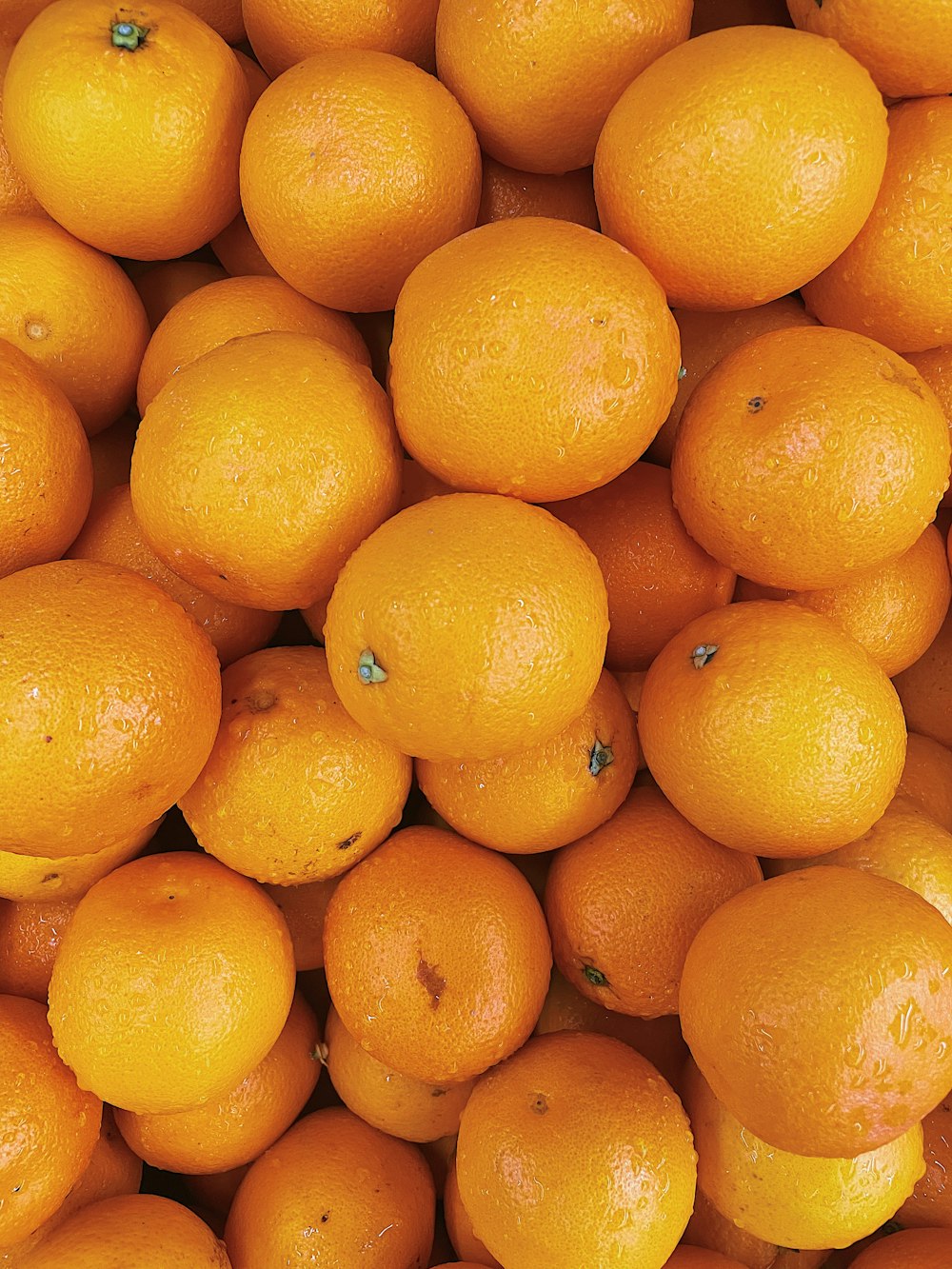 orange fruit on white table