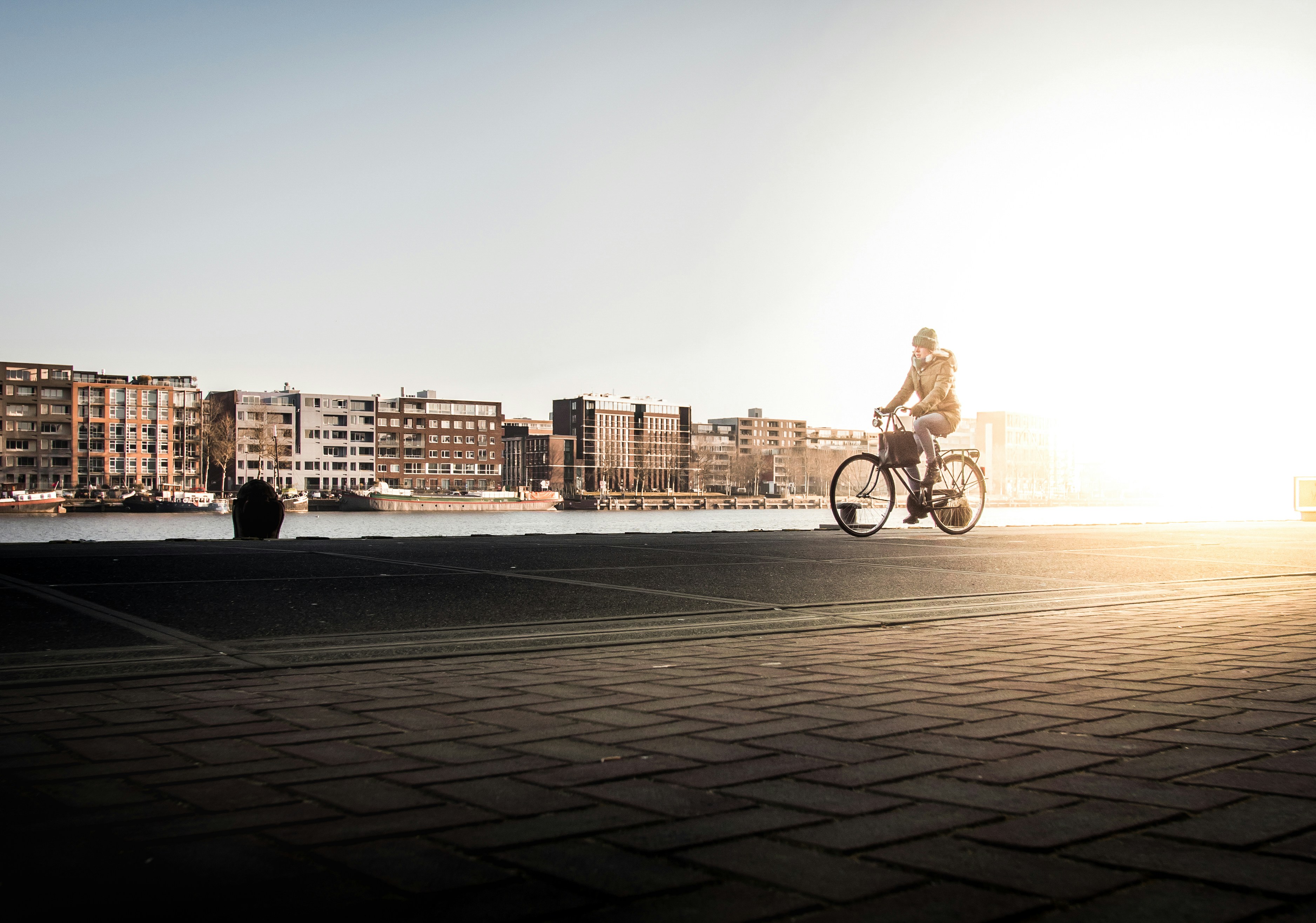 man riding bicycle on road during daytime