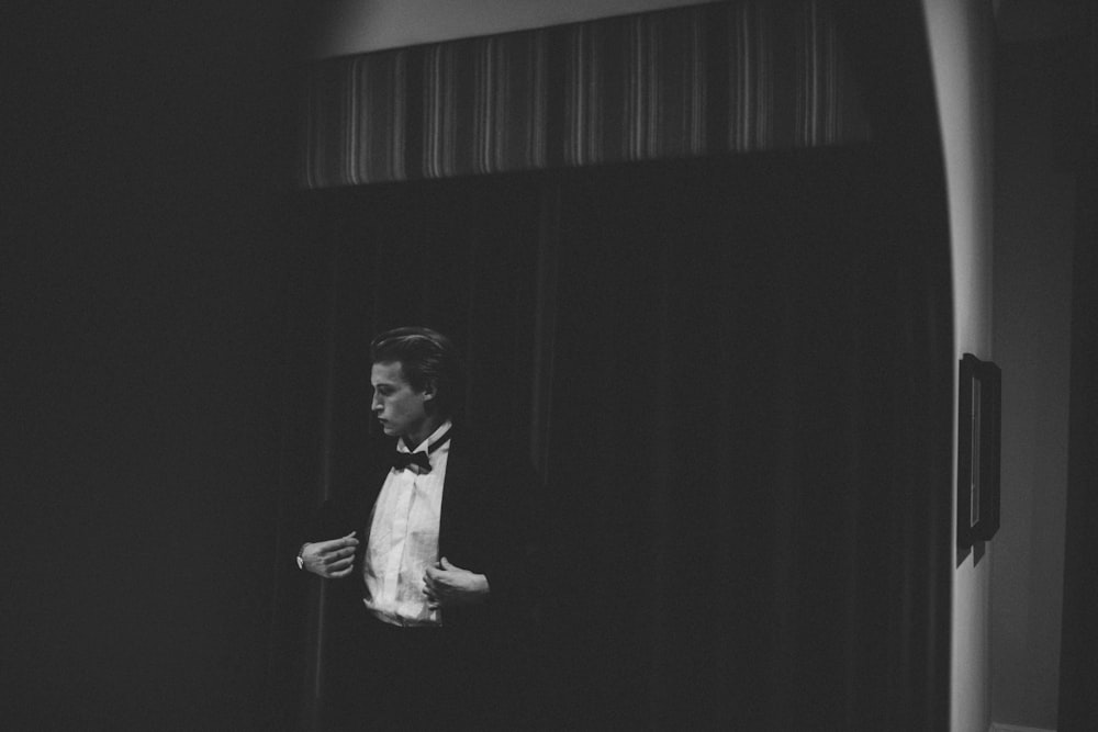 man in black vest and white dress shirt