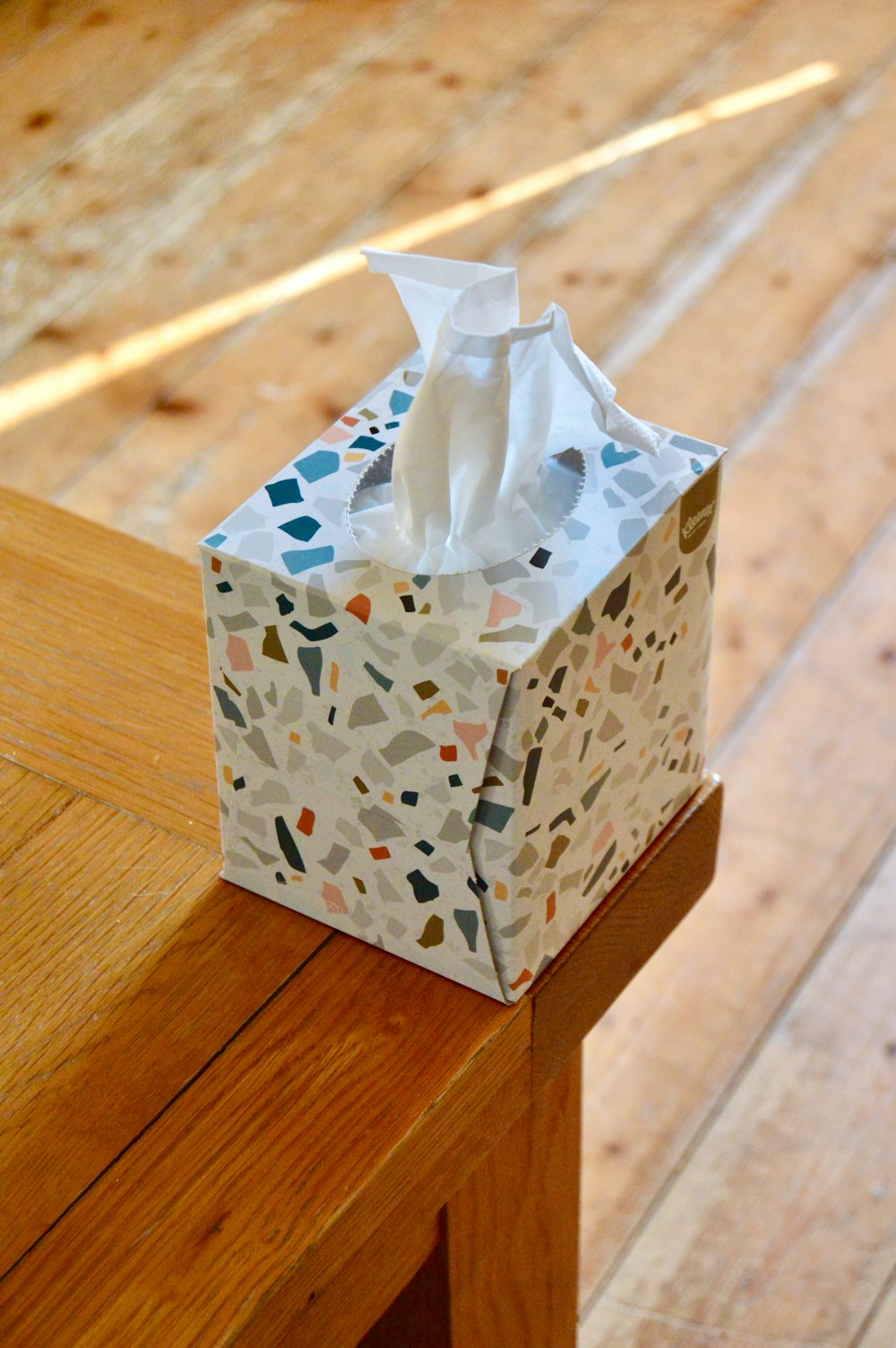 white and blue floral tissue box