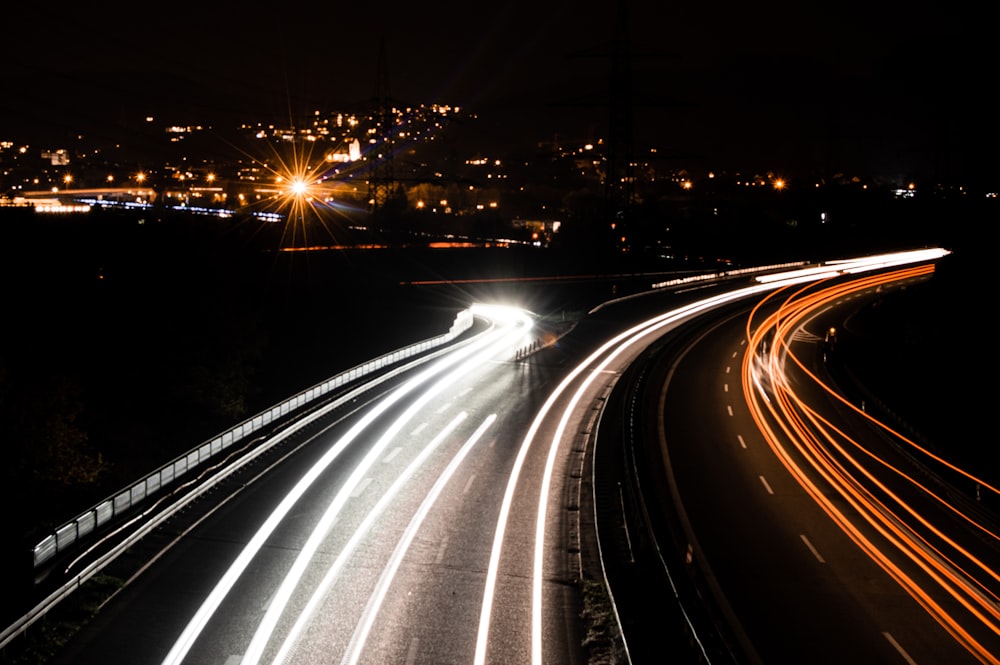 time lapse photography of cars on road during night time