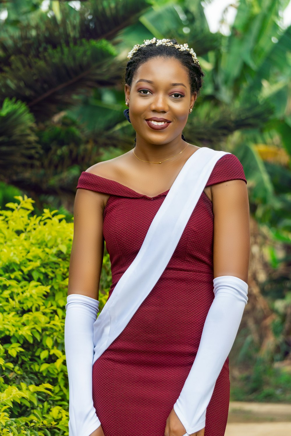 woman in red and white long sleeve shirt smiling