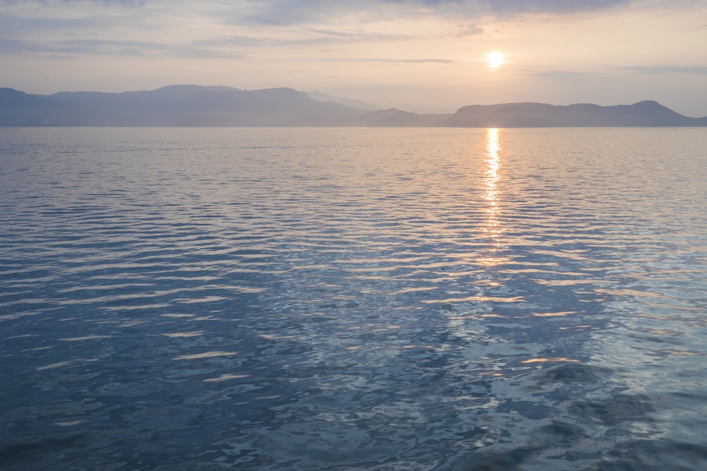 body of water under blue sky during daytime