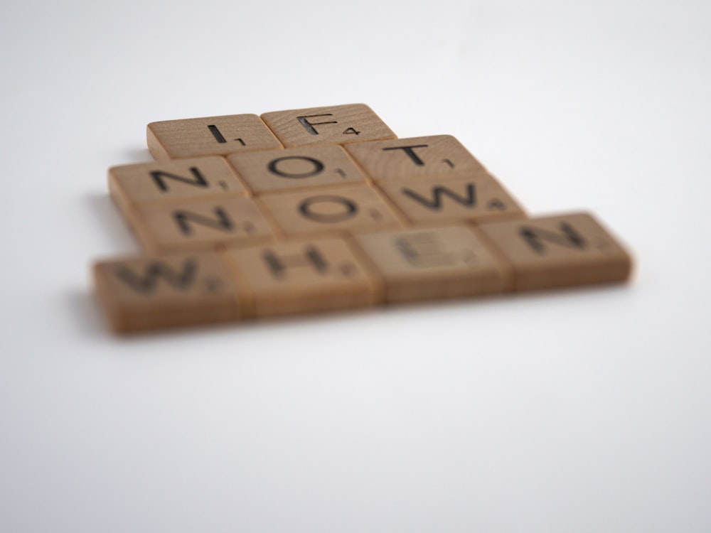 brown wooden letter t-letter