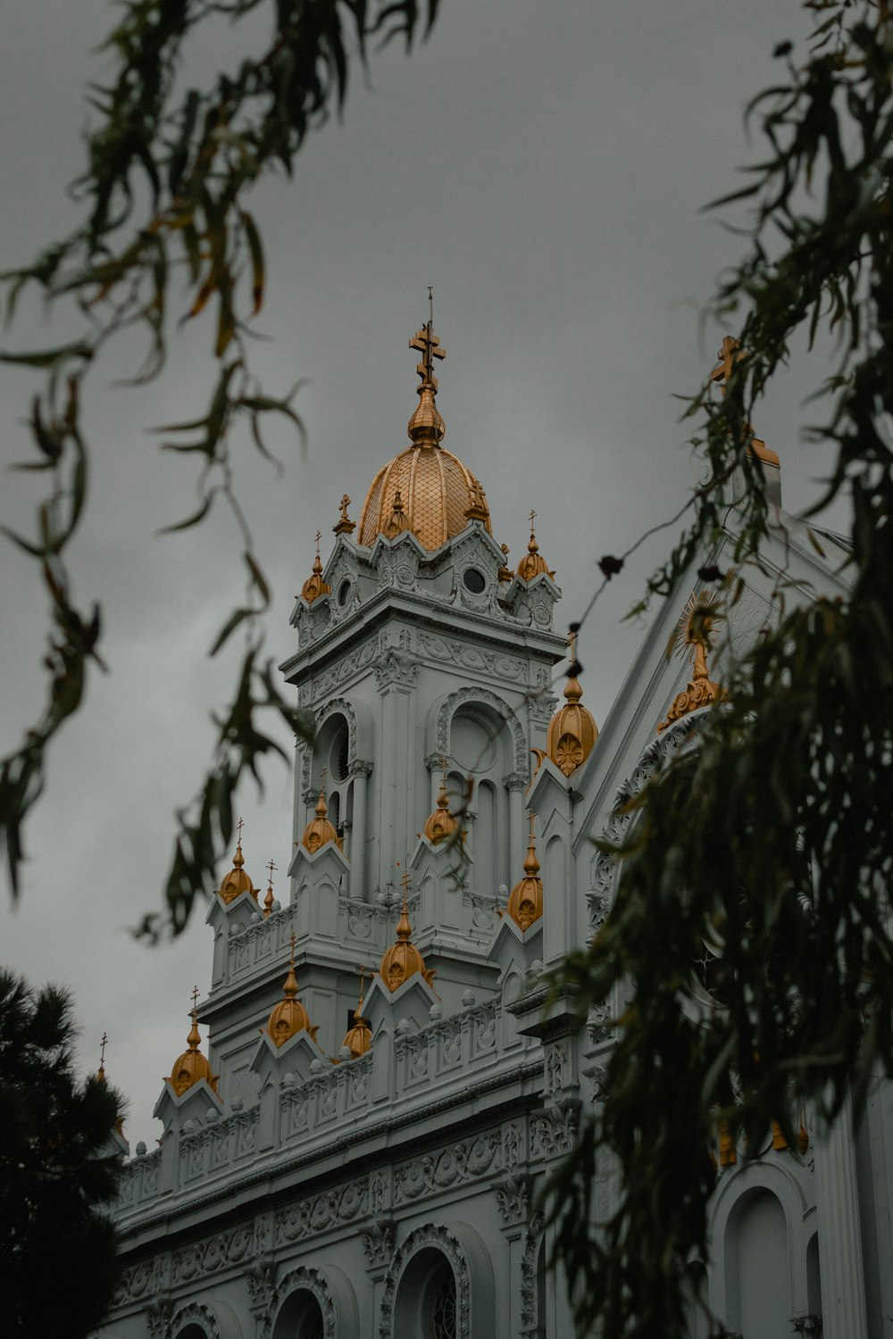 white and gold cathedral under cloudy sky