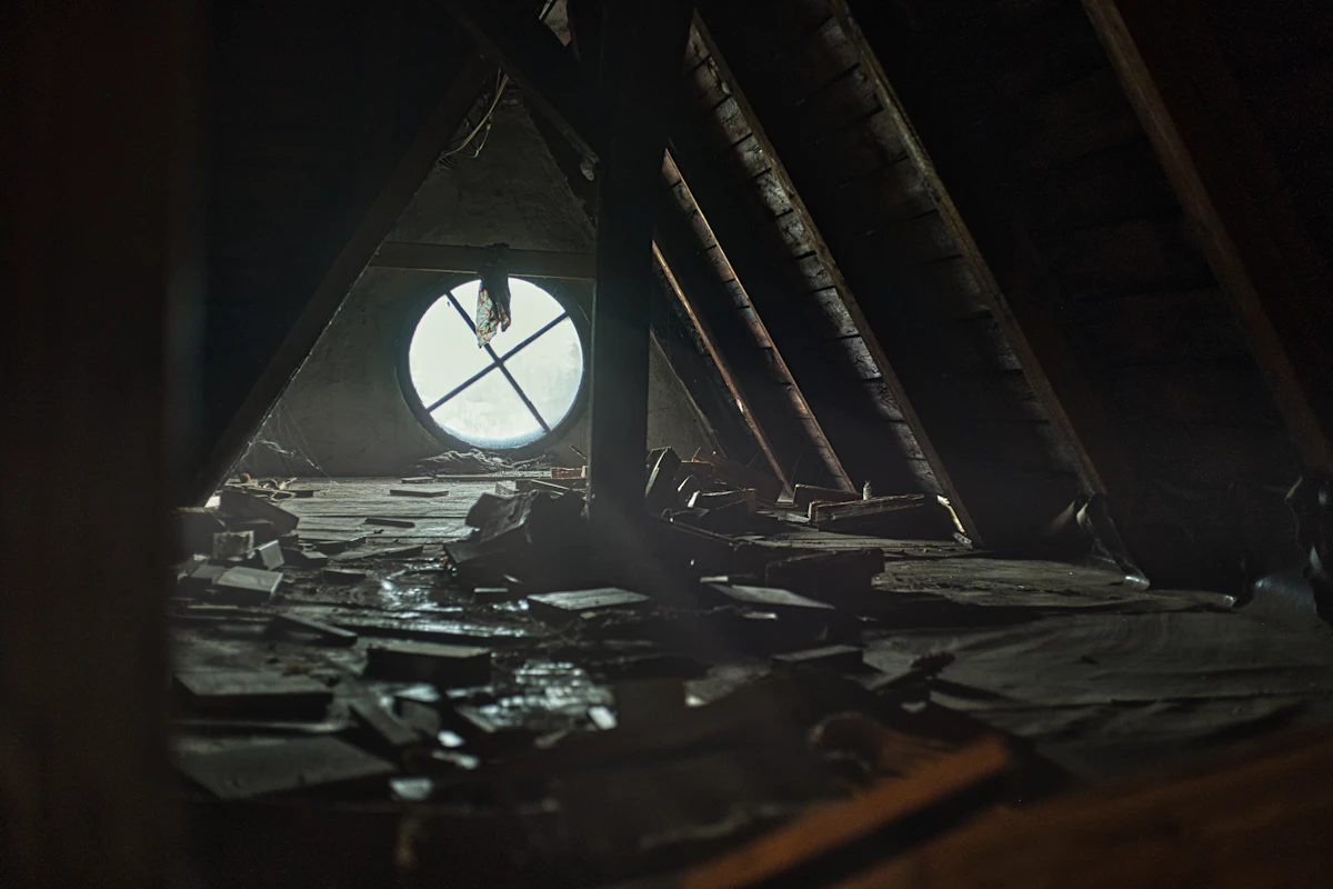 Original knob-and-tube wiring exposed in an open joist bay of an older Spokane home