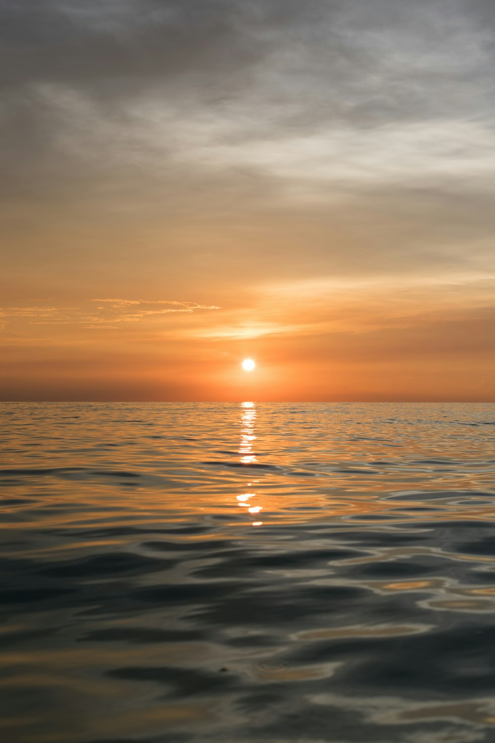 body of water during sunset