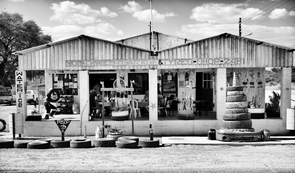 grayscale photo of people in store