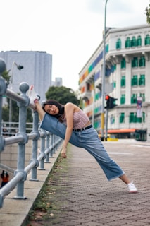 A fitness enthusiast stretching outdoors with city skyline in the background