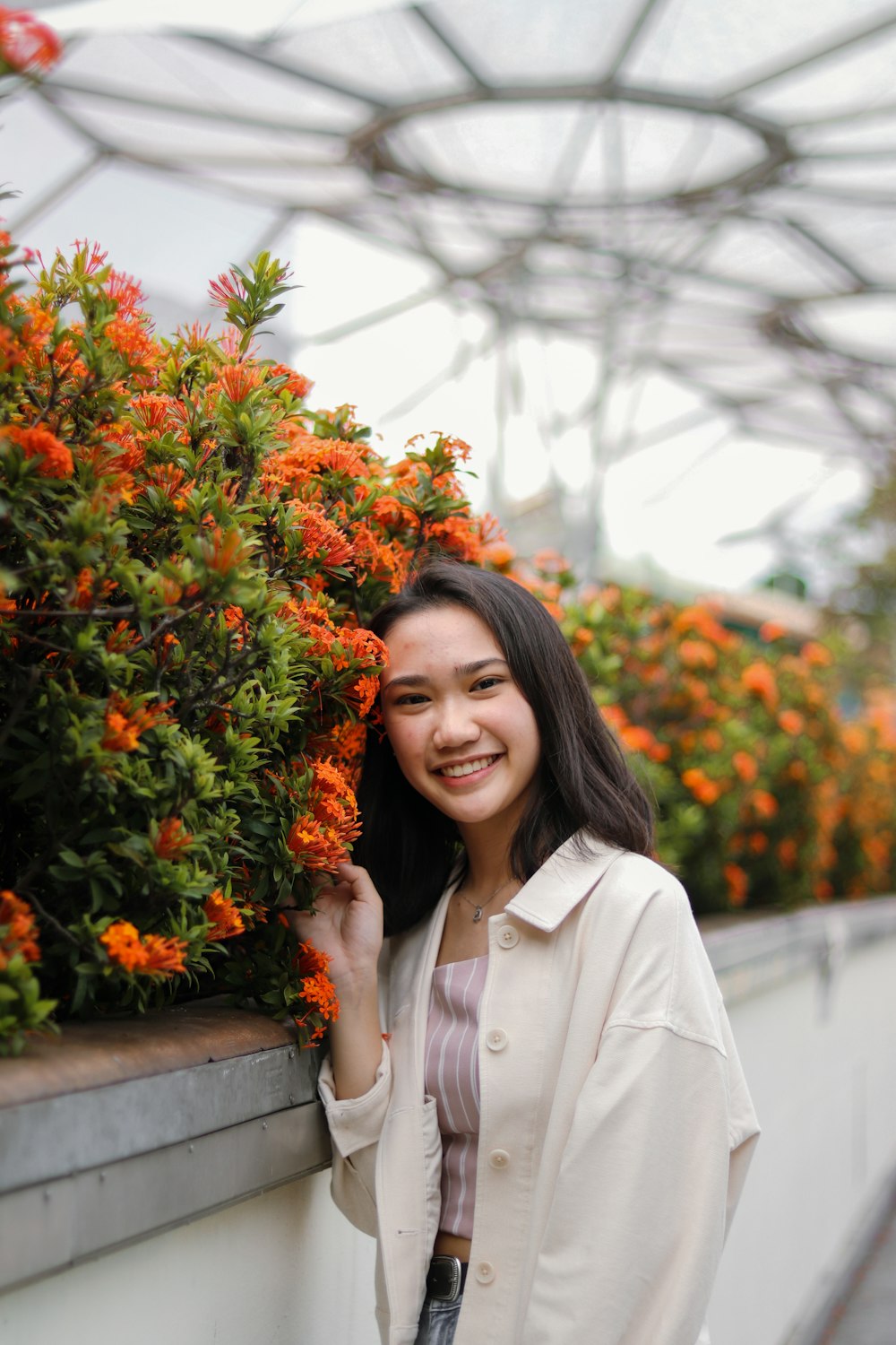 woman in white coat smiling