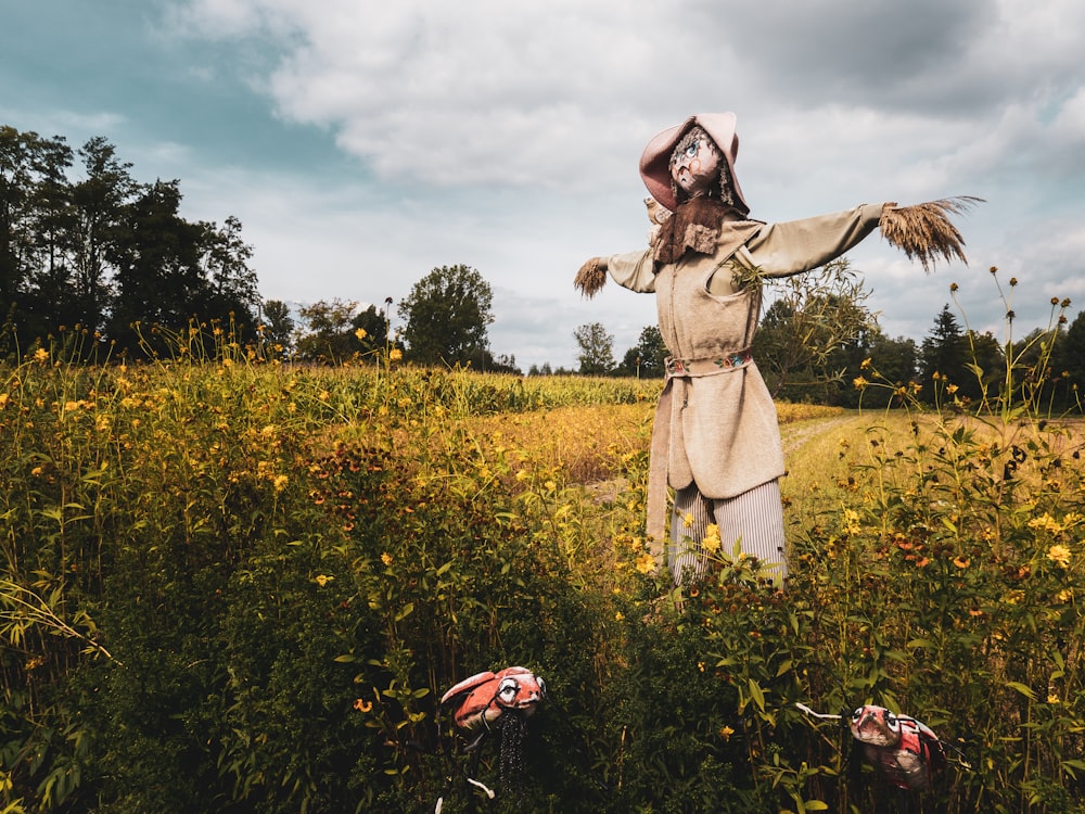 woman in brown dress standing on flower field during daytime