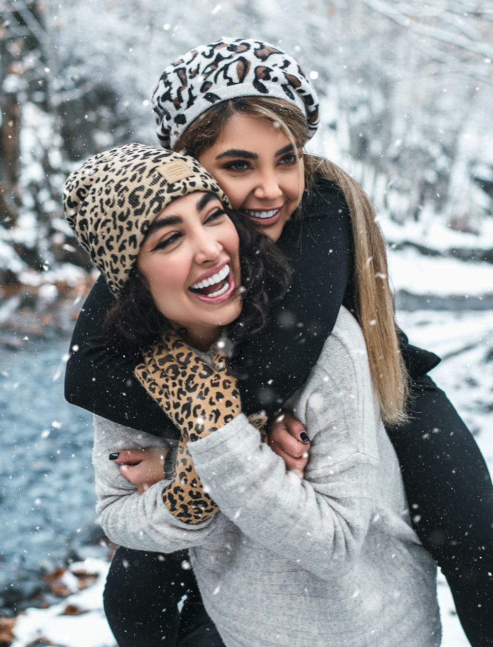 woman in gray coat and leopard scarf smiling