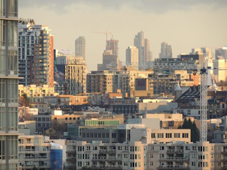 A modern city skyline with high-rise buildings symbolizing home ownership dreams.
