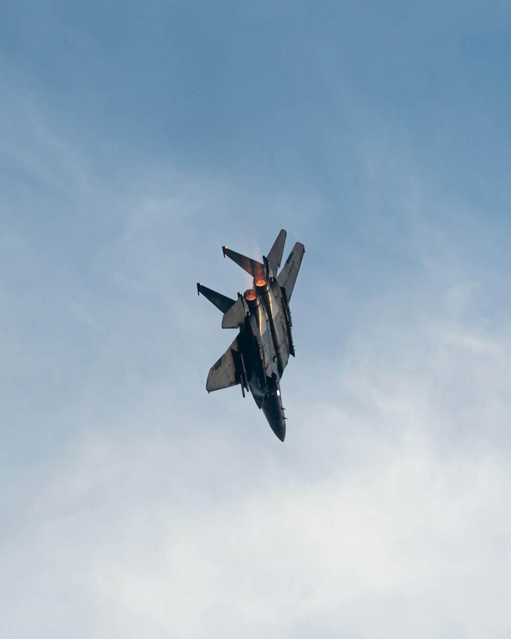 black and red jet plane in mid air