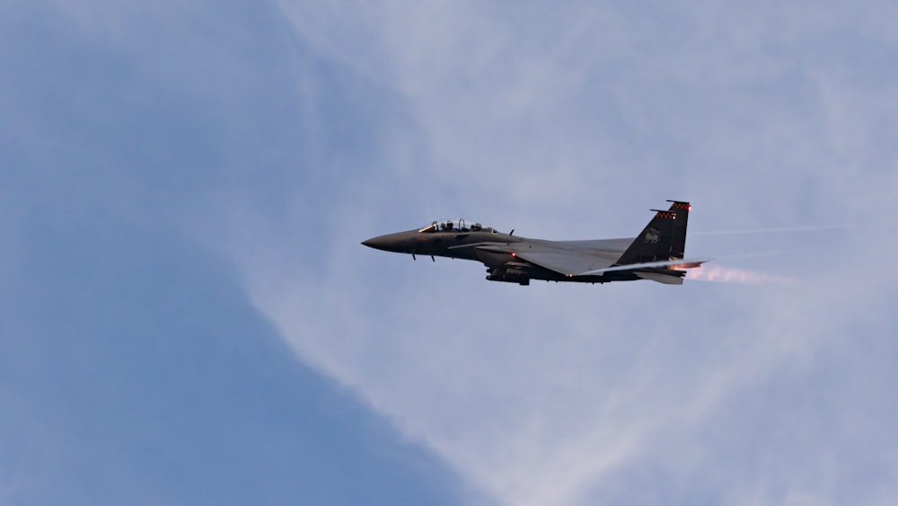 gray fighter jet in mid air during daytime