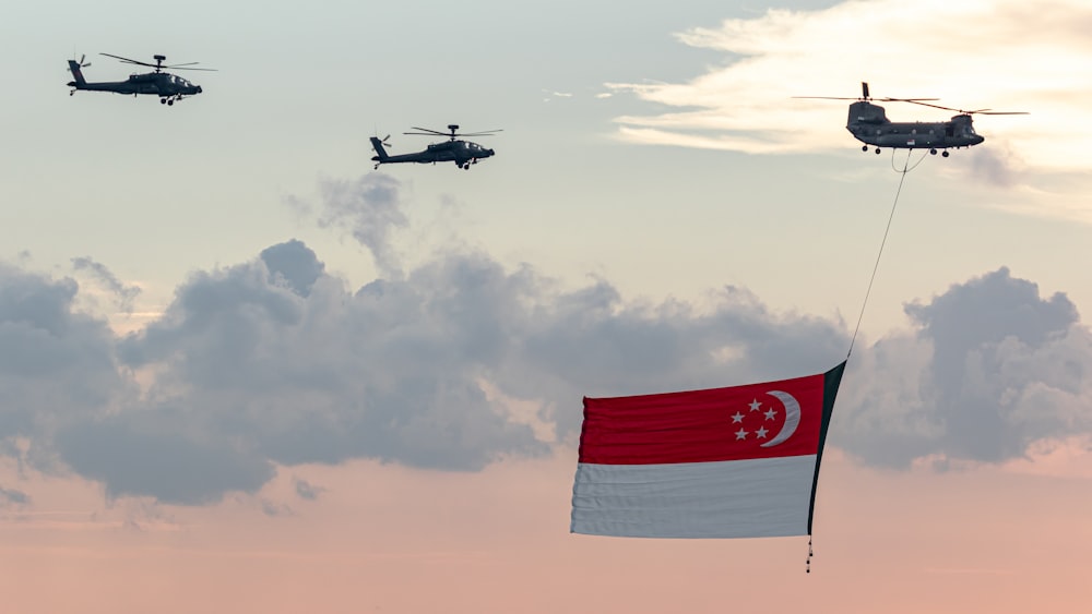 red and white flag on pole under cloudy sky during daytime