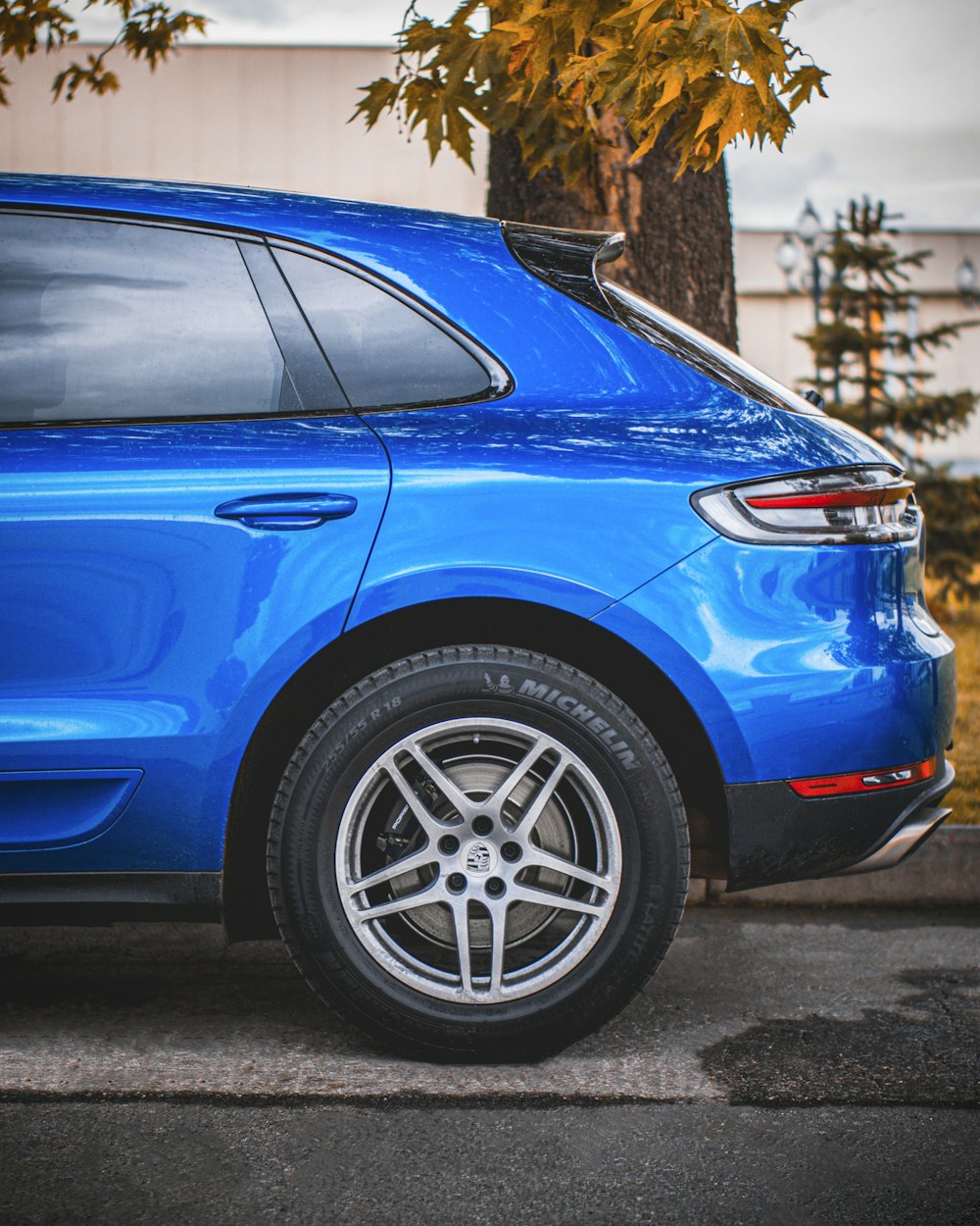 blue car with silver 5 spoke wheel