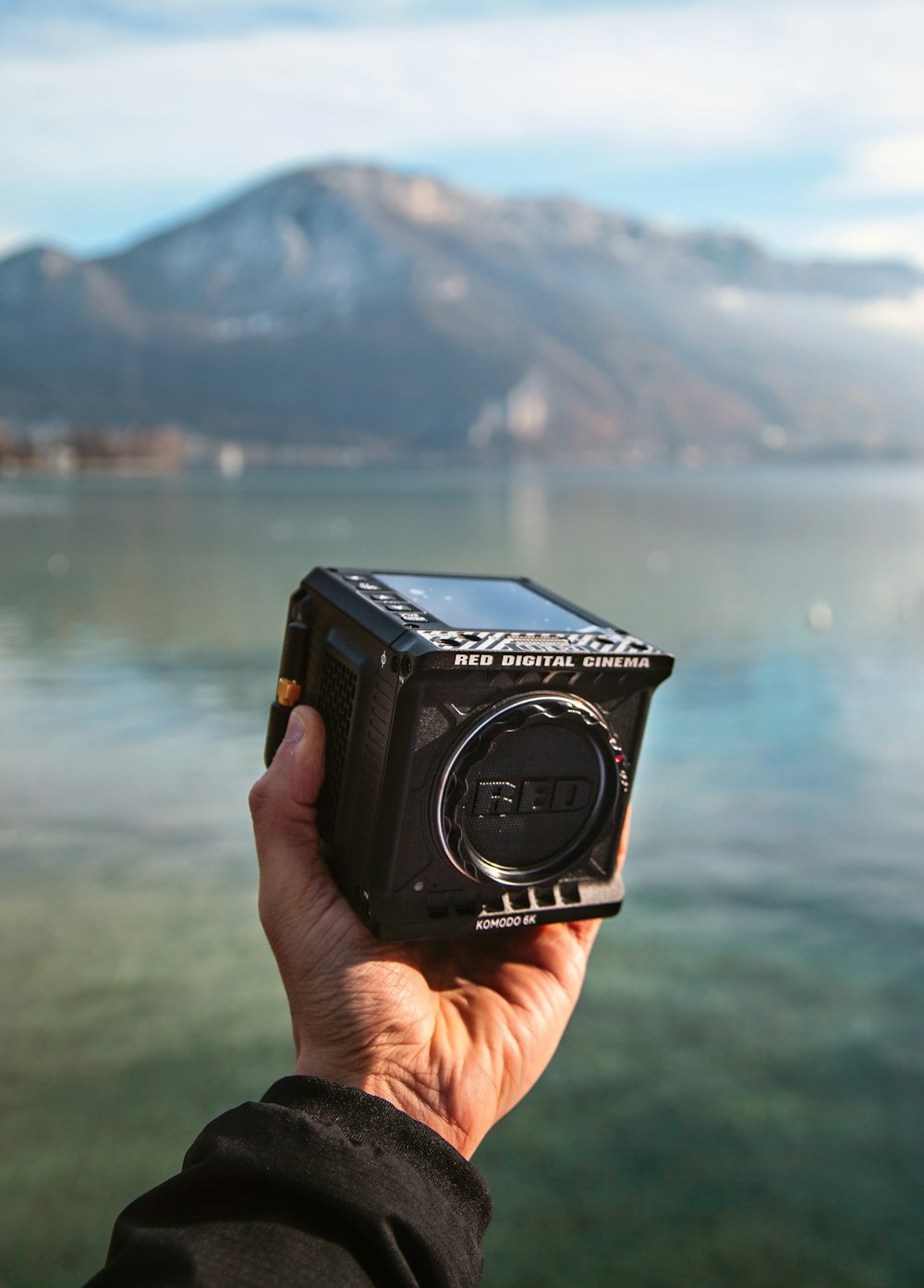 person holding black nikon dslr camera