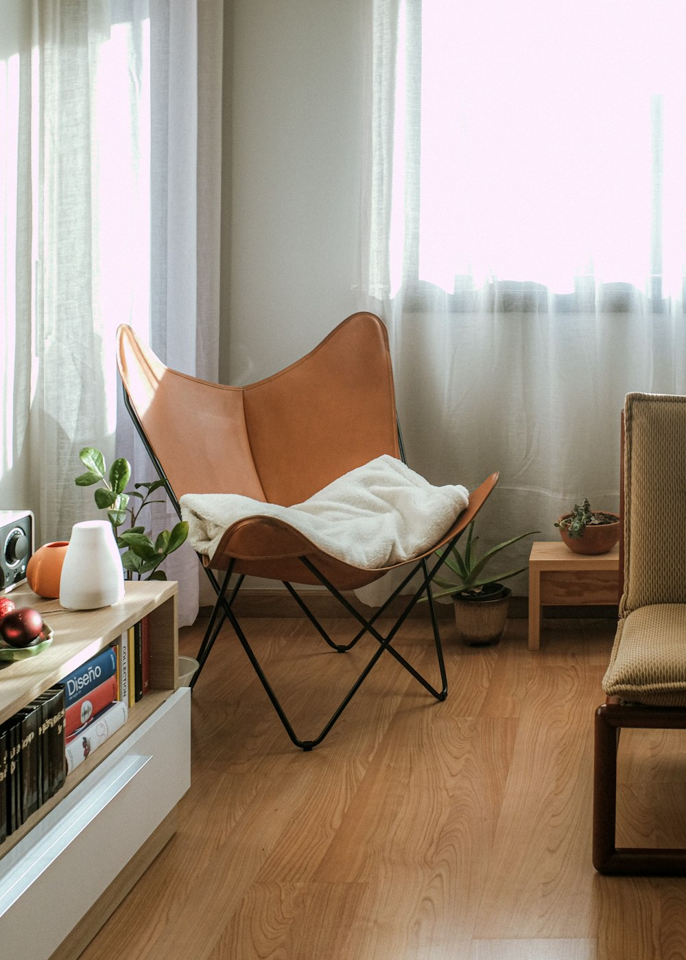 black metal framed white padded chair