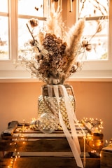 white flowers in clear glass vase