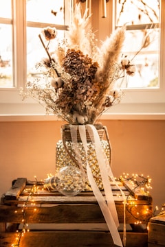 white flowers in clear glass vase