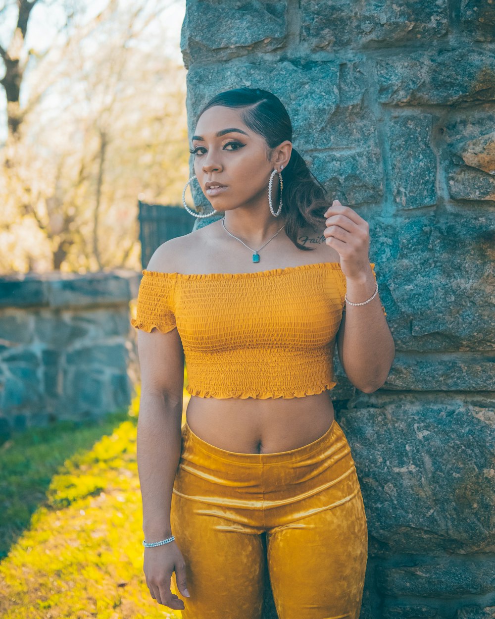 woman in yellow knit shirt and yellow skirt