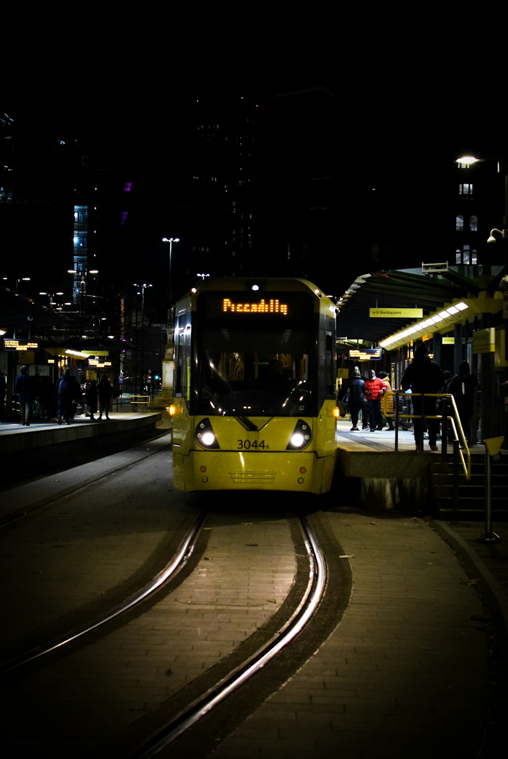 yellow tram on road during night time