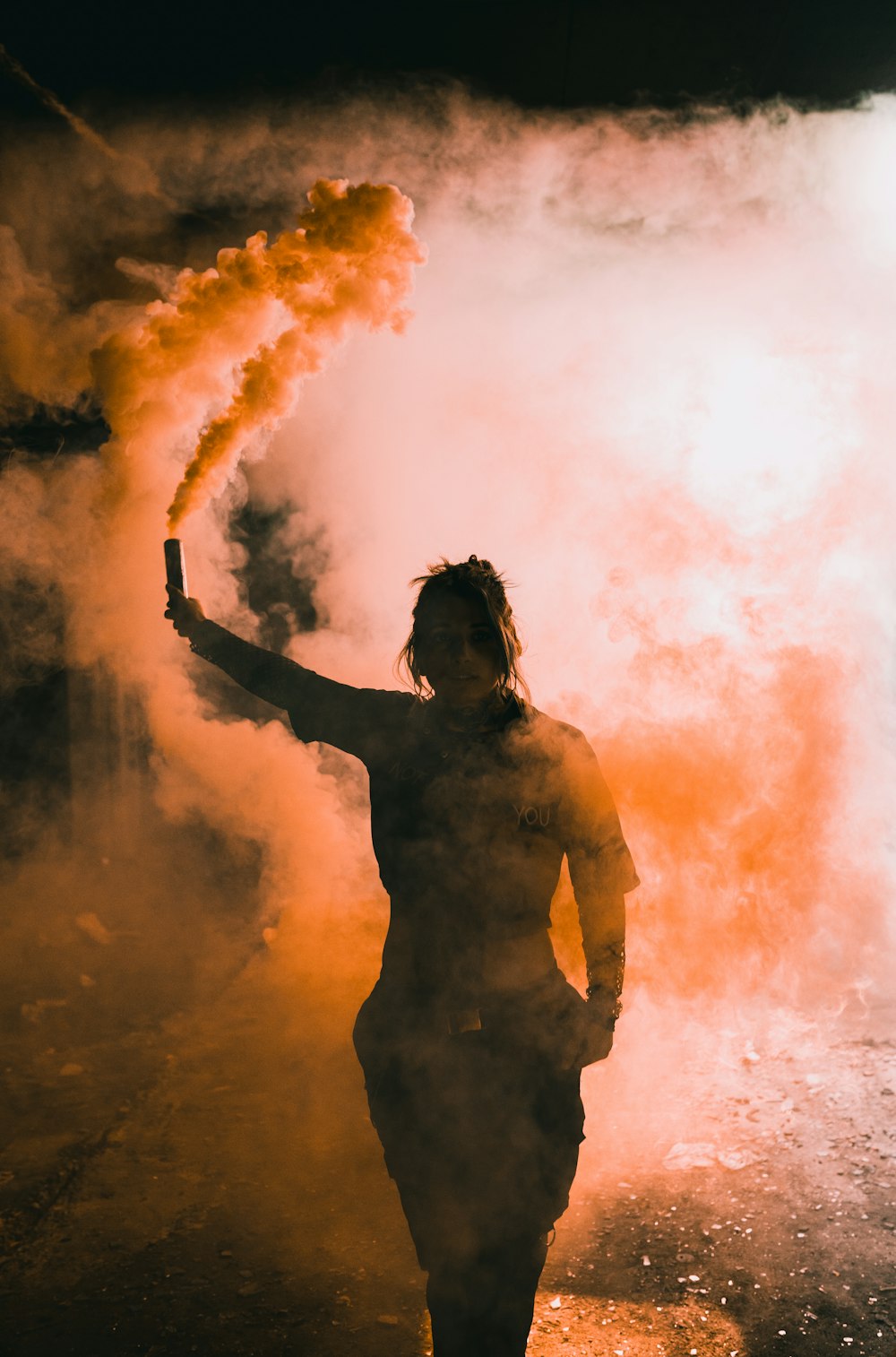 man in yellow shirt smoking