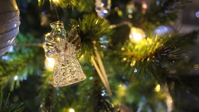 Close-up of detailed 3D LED angel figure glowing in a cozy room