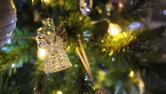 Close-up of detailed 3D LED angel figure glowing in a cozy room