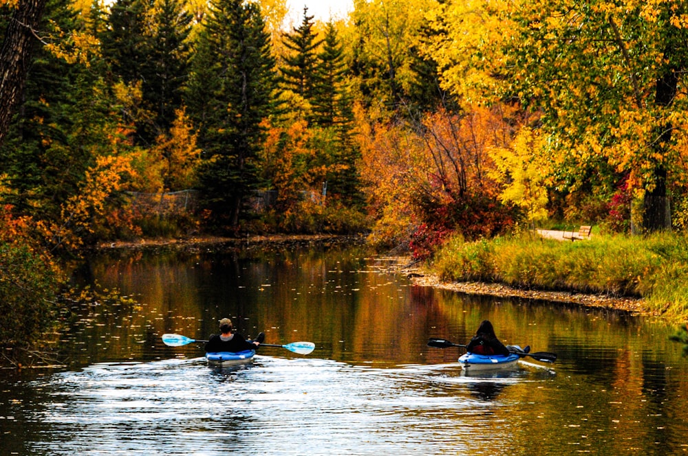 person riding on boat on river during daytime