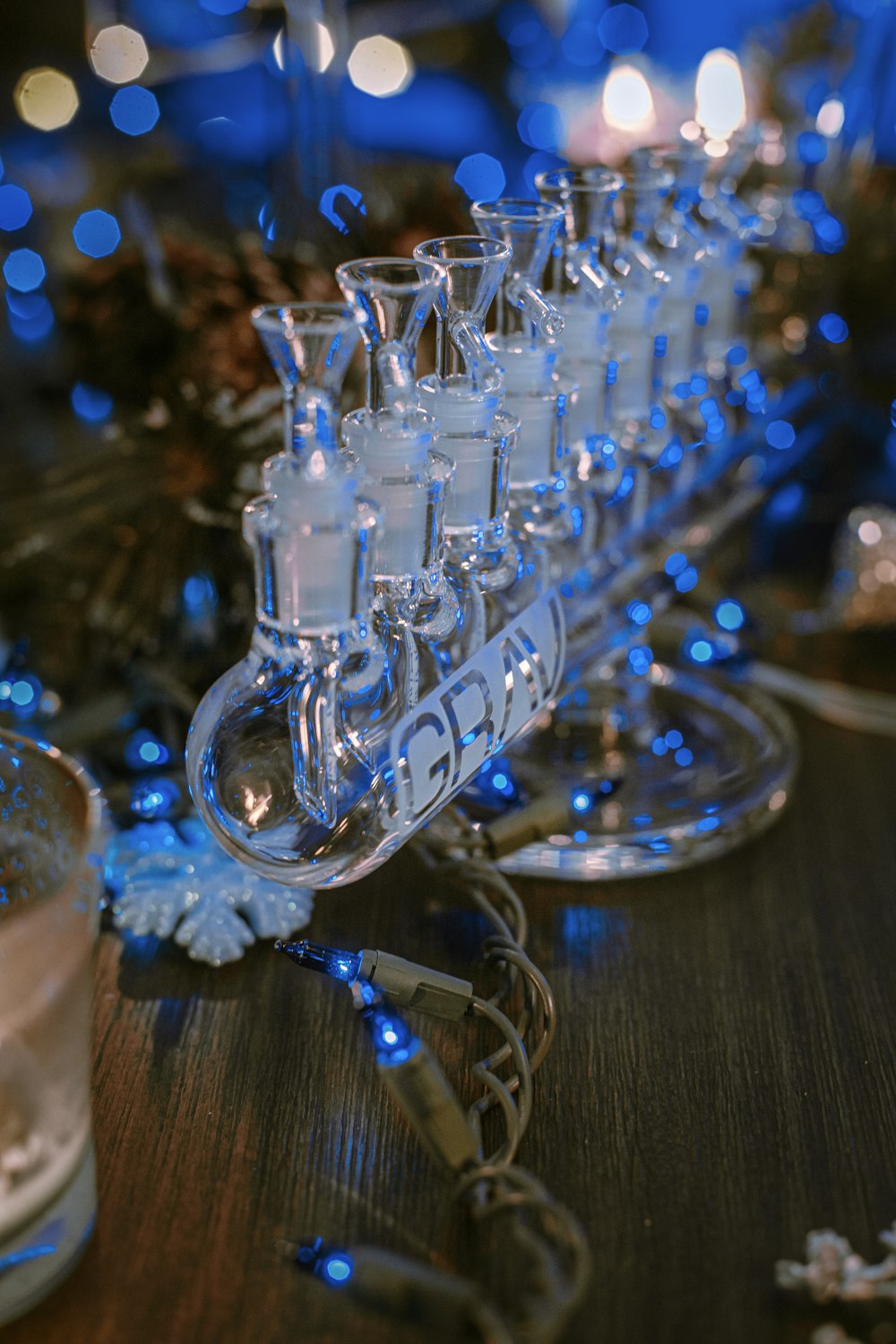 clear glass candle holder on brown wooden table